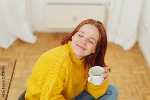 Young woman enjoying a cup of tea