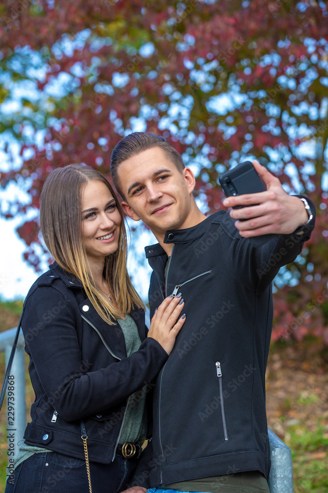 Young couple makes a joint selfie Young couple makes a joint selfie