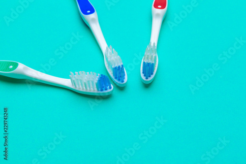 Flat lay composition with manual toothbrushes on color background  close up