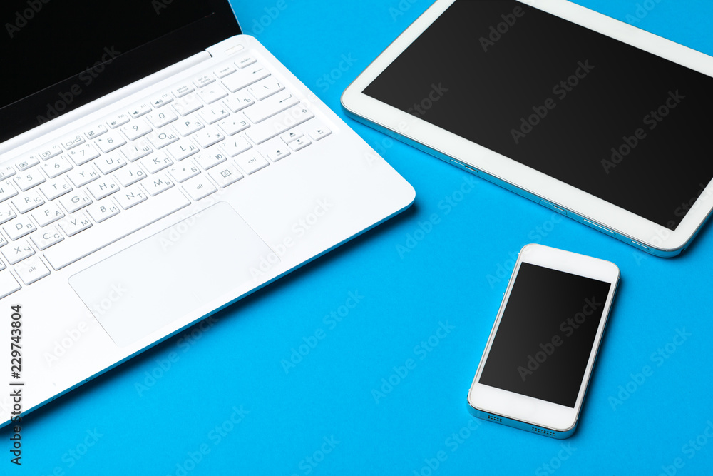 Open laptop with digital tablet on the table Open laptop with digital tablet on the table