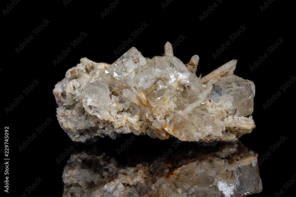 Macro mineral stone fluorite with quartz against black background Macro mineral stone fluorite with quartz against black background