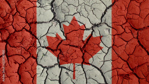 Political Crisis Or Environmental Concept: Mud Cracks With Canada Flag