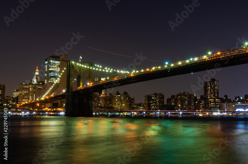 Long time exposure of New York City Brooklyn Bridge  at night viewed from Brooklyn Bridge park