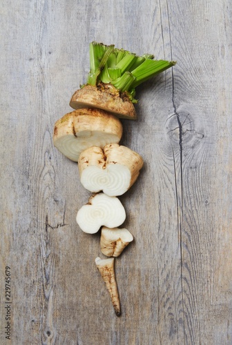 A Sliced Raw Sugar Beet on a Wooden Surface