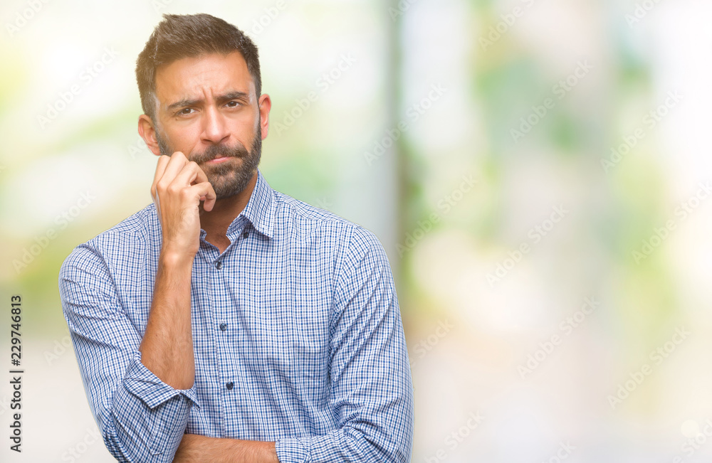 Adult hispanic man over isolated background thinking looking tired and bored with depression problems with crossed arms. Adult hispanic man over isolated background thinking looking tired and bored with depression problems with crossed arms.