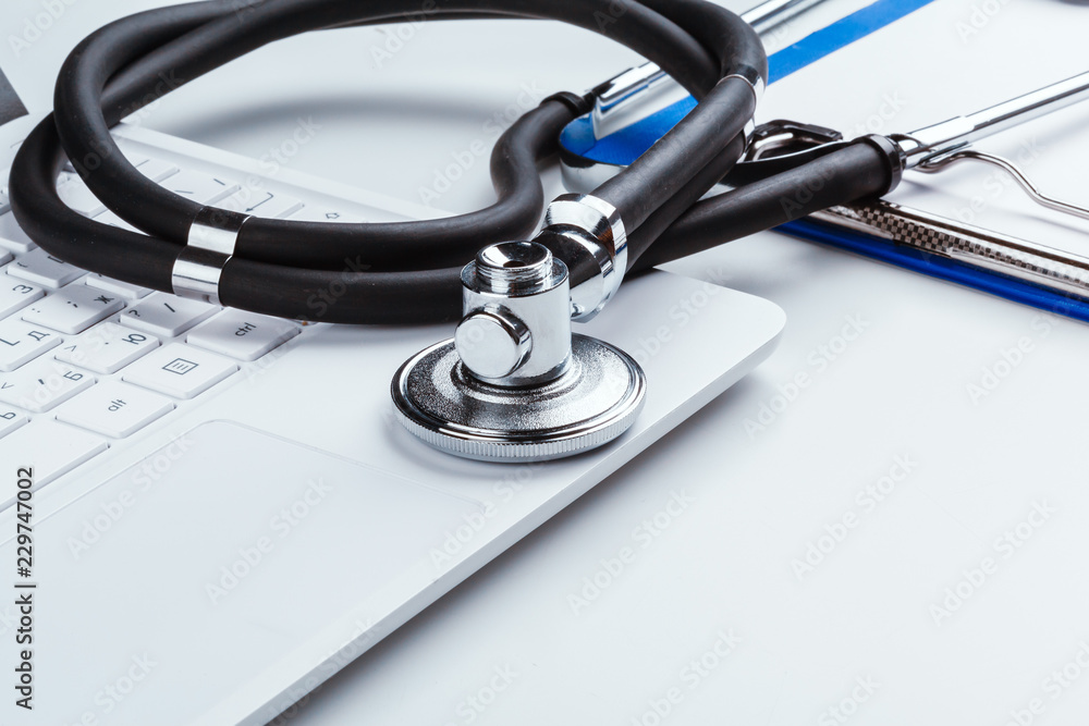 Stethoscope With Laptop on the table Stethoscope With Laptop on the table