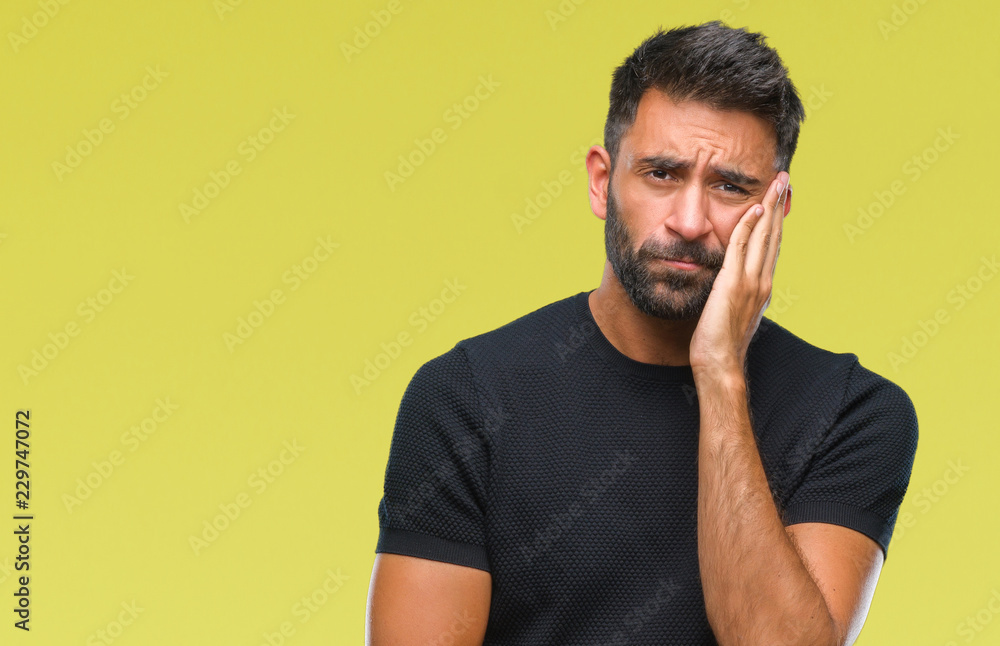 Adult hispanic man over isolated background thinking looking tired and bored with depression problems with crossed arms. Adult hispanic man over isolated background thinking looking tired and bored with depression problems with crossed arms.
