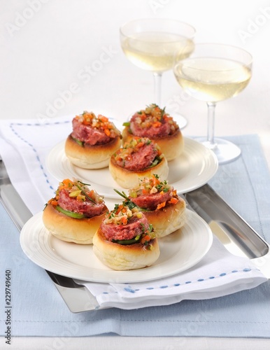 Pane condito con cotechino (rolls topped with raw sausage meat, Italy) photo