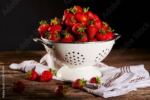 Strawberries in a colander photo