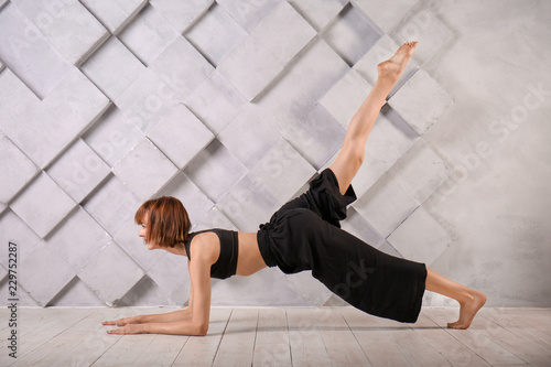 Sporty woman practicing yog...