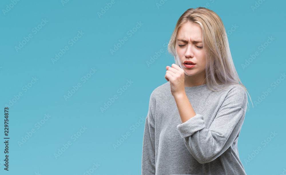 Young blonde woman over isolated background feeling unwell and coughing as symptom for cold or bronchitis. Healthcare concept. Young blonde woman over isolated background feeling unwell and coughing as symptom for cold or bronchitis. Healthcare concept.