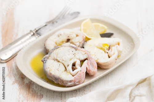 boiled fish with lemon and olive oil