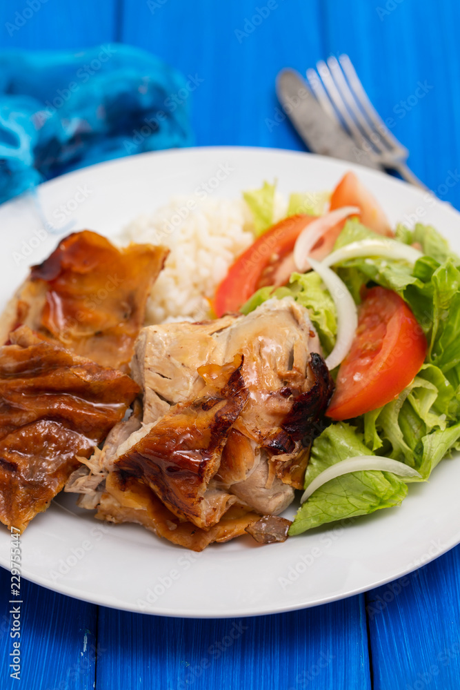 roasted pork with boiled rice and salad on white plate roasted pork with boiled rice and salad on white plate