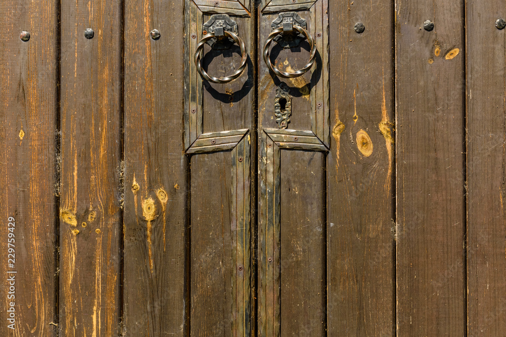 Old doors with metal round doorknobs Old doors with metal round doorknobs