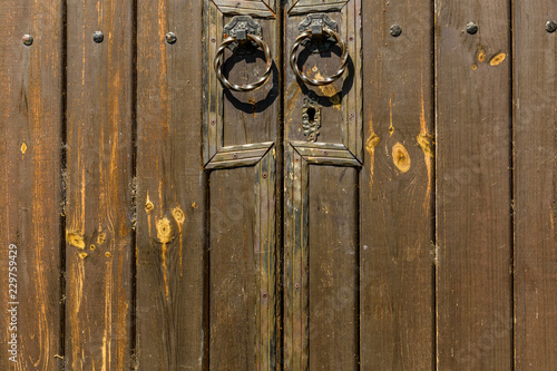 Old doors with metal round doorknobs