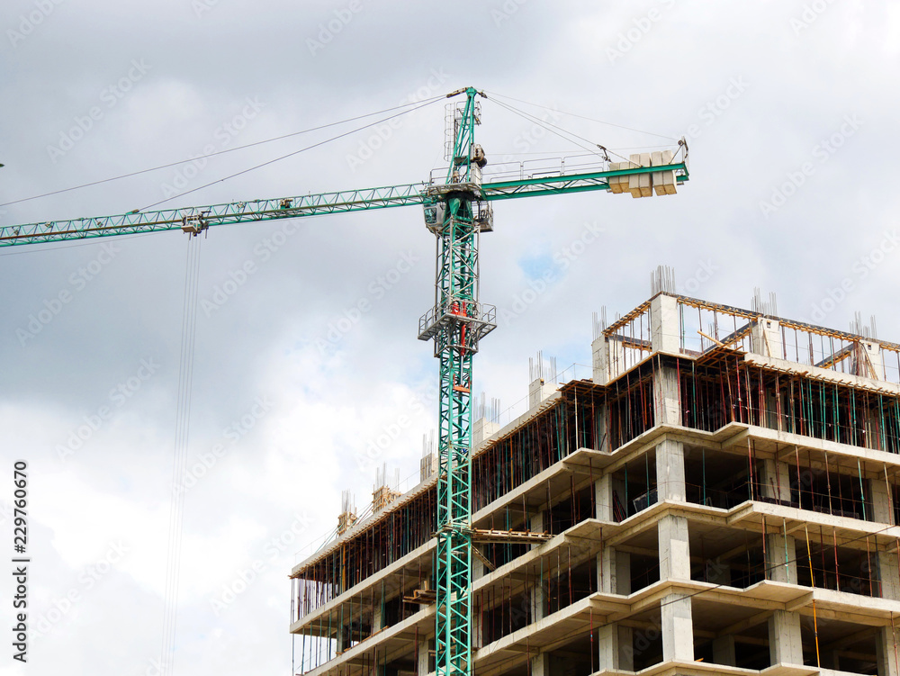 Construction site. Construction site with crane and building. Self-erection crane near building. Construction site. Construction site with crane and building. Self-erection crane near building.