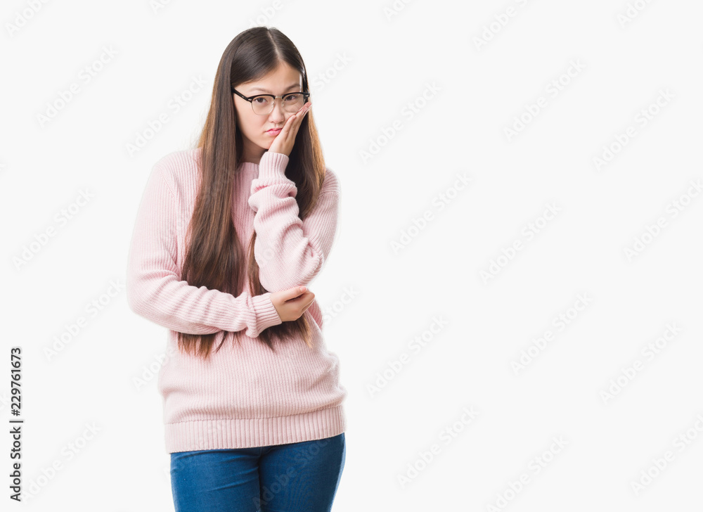 Young Chinese woman over isolated background wearing glasses thinking looking tired and bored with depression problems with crossed arms. Young Chinese woman over isolated background wearing glasses thinking looking tired and bored with depression problems with crossed arms.