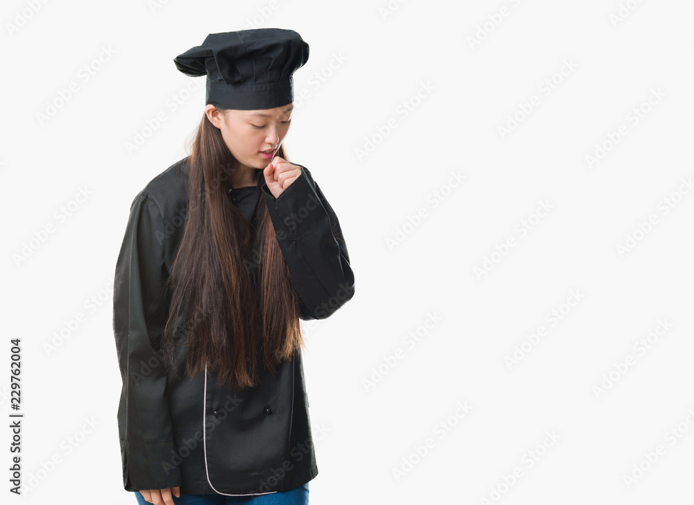 Young Chinese woman over isolated background wearing chef uniform feeling unwell and coughing as symptom for cold or bronchitis. Healthcare concept. Young Chinese woman over isolated background wearing chef uniform feeling unwell and coughing as symptom for cold or bronchitis. Healthcare concept.