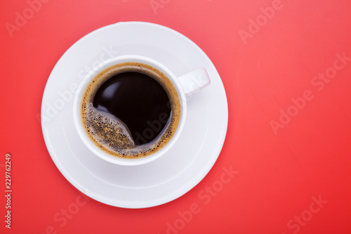 Cup of black coffee on table top view, flat lay, mock up. Cup of Black Coffee in White Ceramic Cup on plastic Tabletop