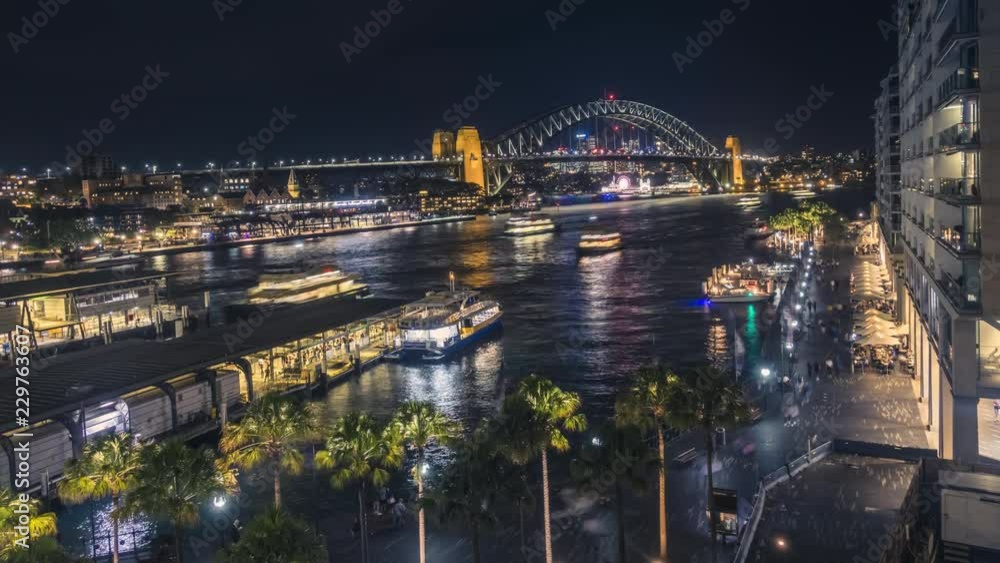 Timelapse video of spectacular Sydney Harbour Bridge at night, with bright city lights and ferries sailing in the harbour. Timelapse video of spectacular Sydney Harbour Bridge at night, with bright city lights and ferries sailing in the harbour.