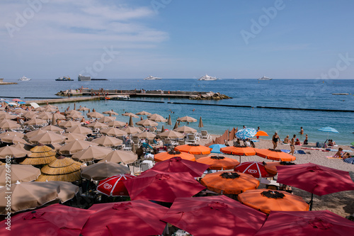 Beach umbrellas in Nice near the sea in the south