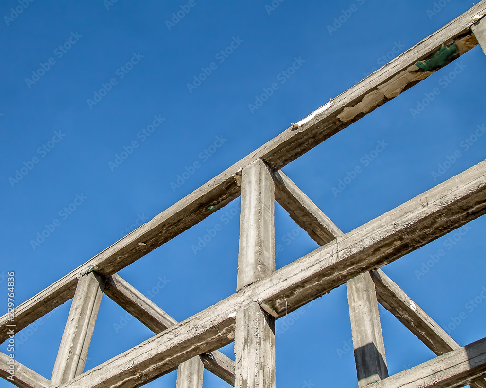 Reinforced concrete frame of a building against the sky Reinforced concrete frame of a building against the sky
