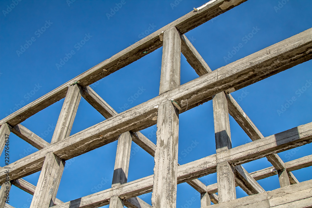 Reinforced concrete frame of a building against the sky