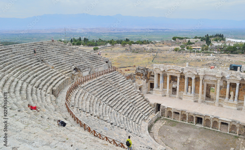 Scene of ancient theater with sculptures of mythical heroes in the ancient Turkish city of Hieropolis