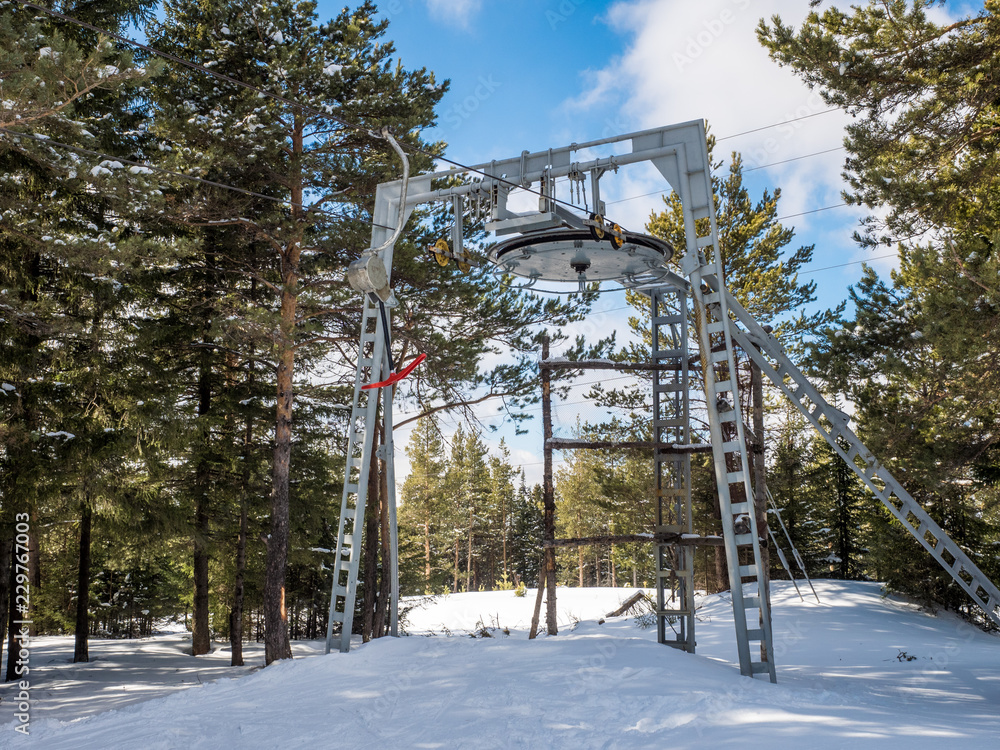 ski lift on the ski slopes. chair lift active rest and sport. people skiing downhill. ski resort