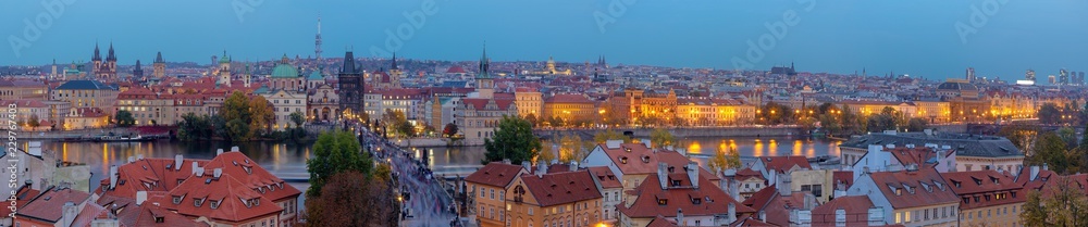 Prague - The panorama of the city with the Charles bridge on Olt Town at dusk.