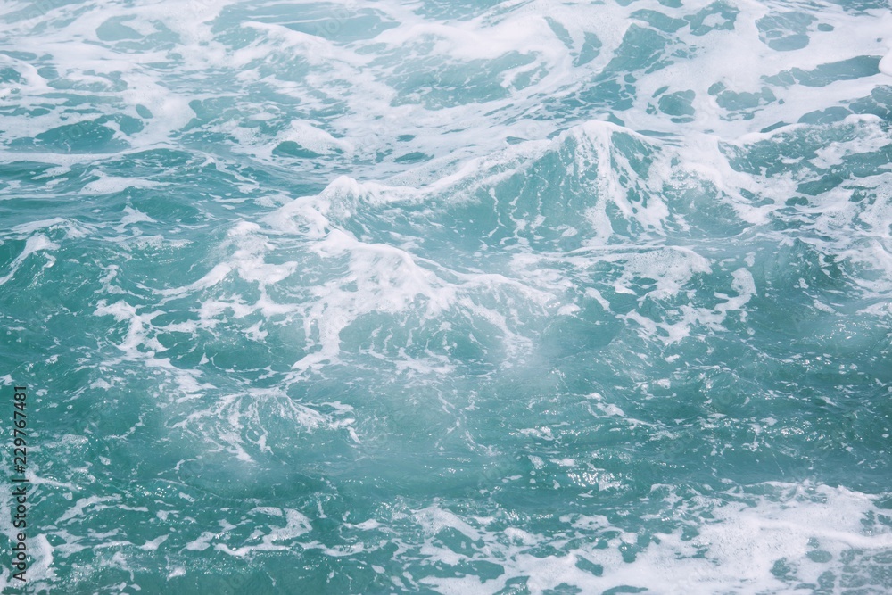 Obraz premium Sea Waves in ocean wave Splashing Ripple Water. Blue water background. 