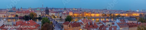 Prague - The panorama of the city with the Charles bridge on Olt Town at dusk.