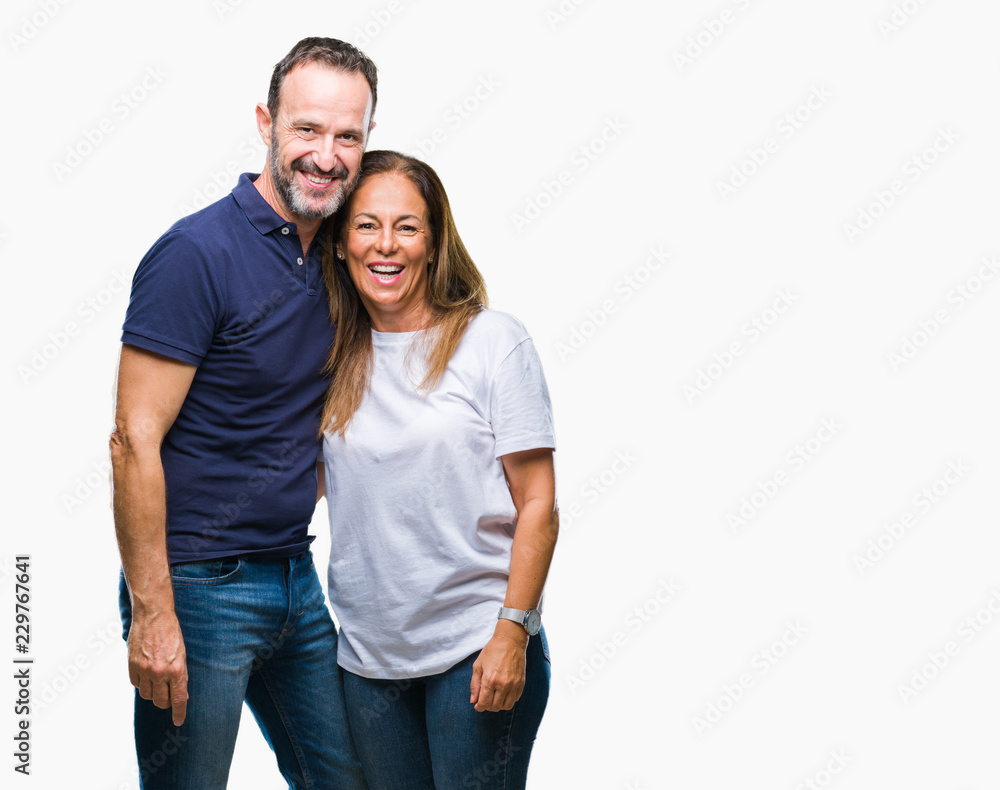 Fototapeta premium Middle age hispanic casual couple over isolated background with a happy and cool smile on face. Lucky person.