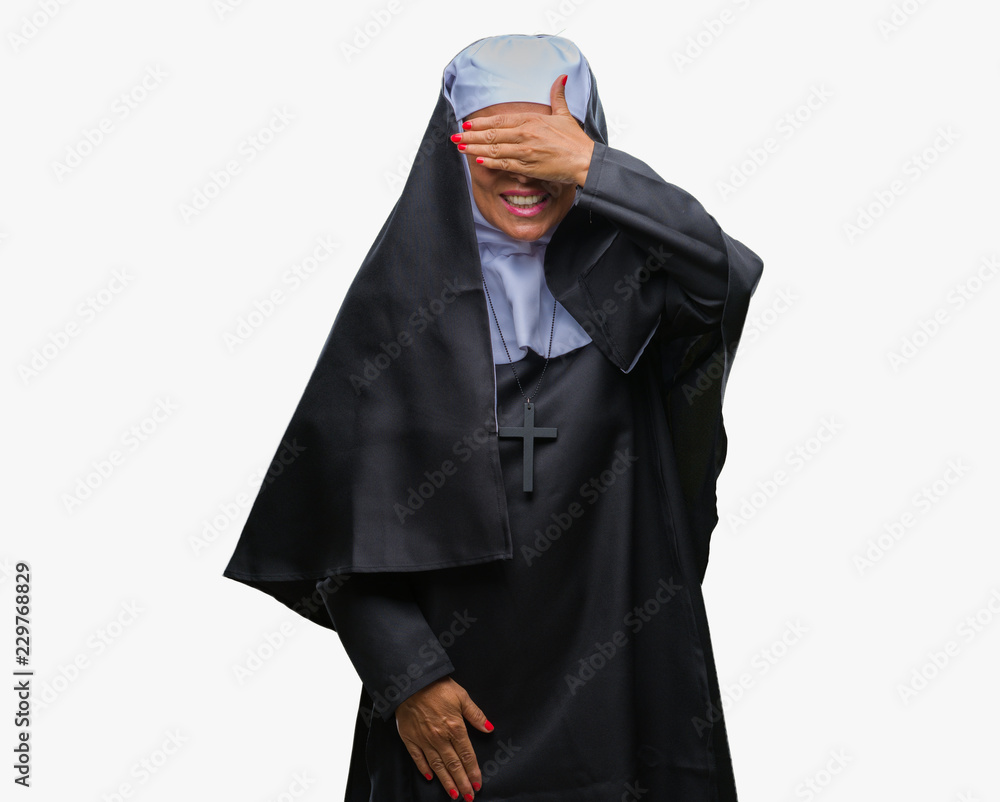 Middle age senior christian catholic nun woman over isolated background  smiling and laughing with hand on face covering eyes for surprise. Blind  concept. Stock Photo | Adobe Stock