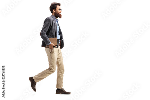 Man holding books and walking