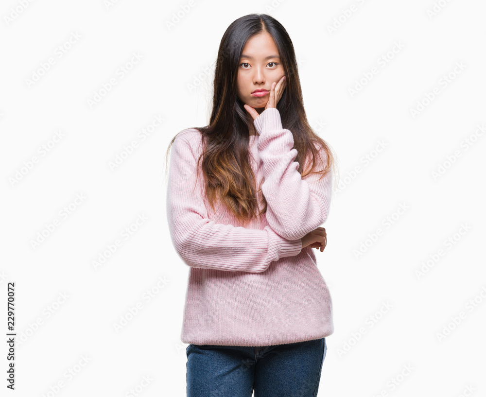 Young asian woman over isolated background thinking looking tired and bored with depression problems with crossed arms. Young asian woman over isolated background thinking looking tired and bored with depression problems with crossed arms.