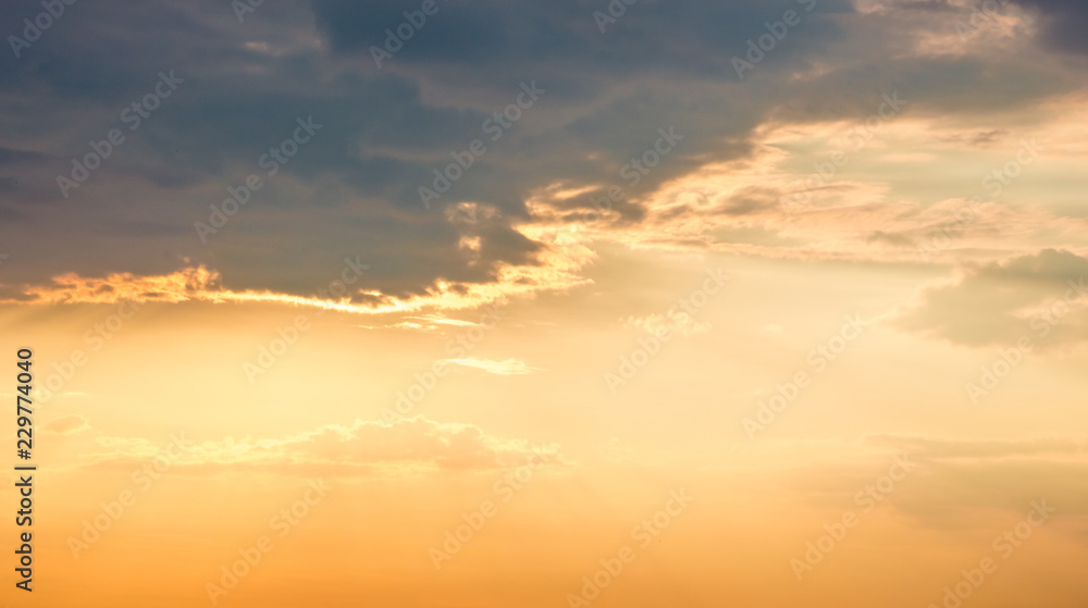 Colorful clouds in the sky during the sunset, background for design_