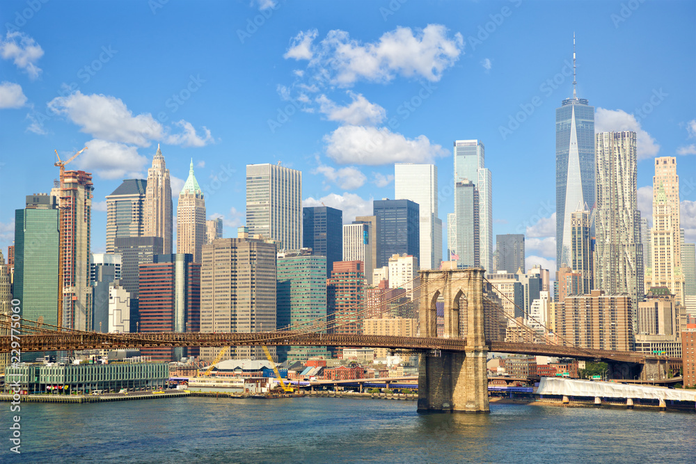 Lower Manhattan skyline with Brooklyn Bridge in New York City