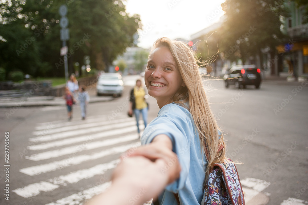 Fototapeta premium Young caucasian girl in love on a street