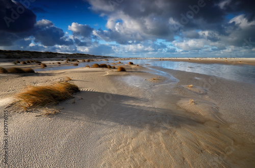 sandy North sea beach at high tide photo