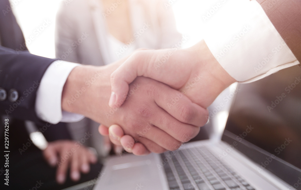 Two confidence businessman shaking hands close-up Two confidence businessman shaking hands close-up