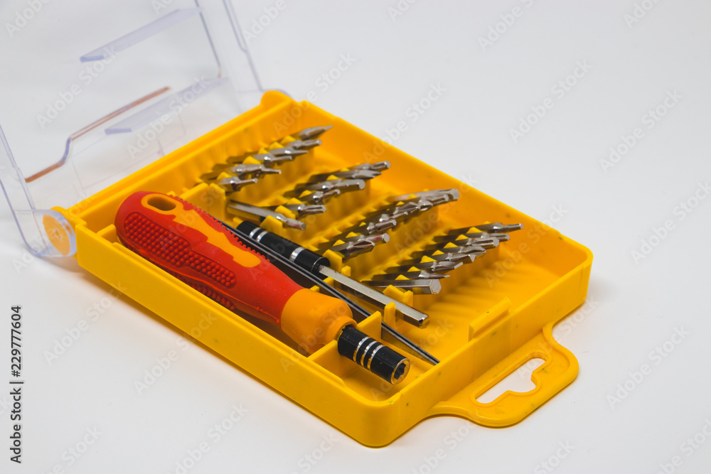 Screwdriver tips in a white background.  The screwdriver bit set in toolbox.
