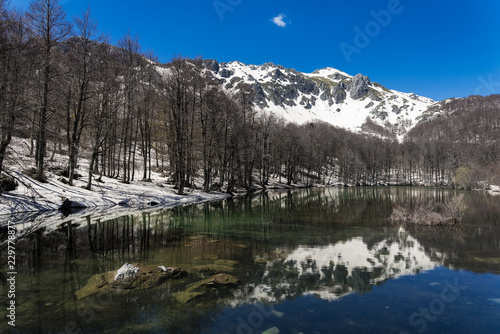 Winter landscape with the Arrenes or Moutsalia alpine lake on Mt Grammos in Greece