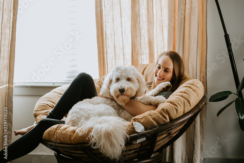 Girl with her dog at home