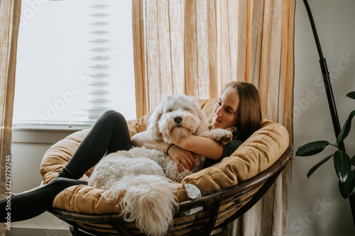 Girl with her dog at home