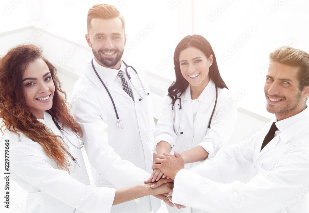 friendly team of doctors shows their success friendly team of doctors shows their success