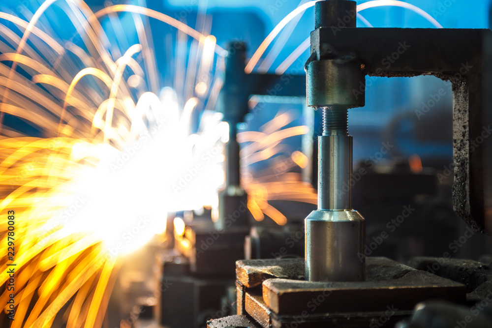 Fototapeta premium Welding robots movement in a car factory,