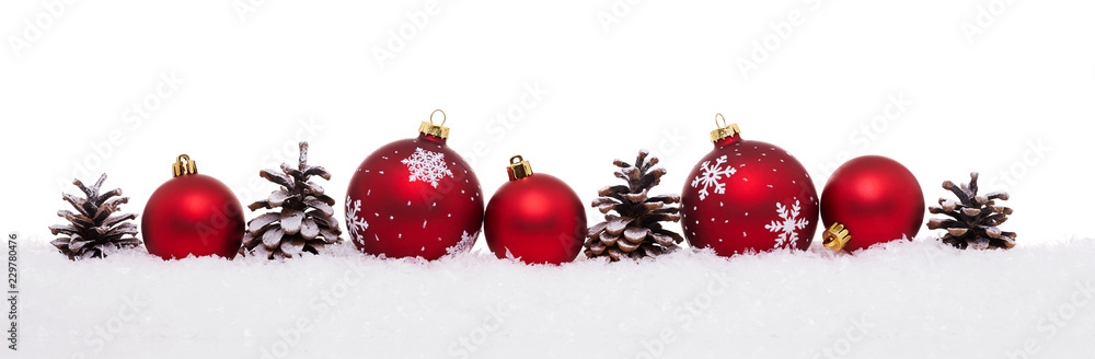 Red baubles and pine cones isolated on snow, Christmas banner Red baubles and pine cones isolated on snow, Christmas banner