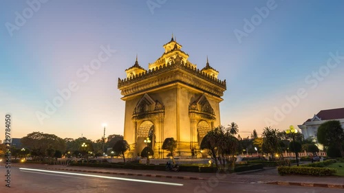 Vientiane Laos time lapse 4K, city skyline day to night sunset timelapse at Patuxai (Patuxay)