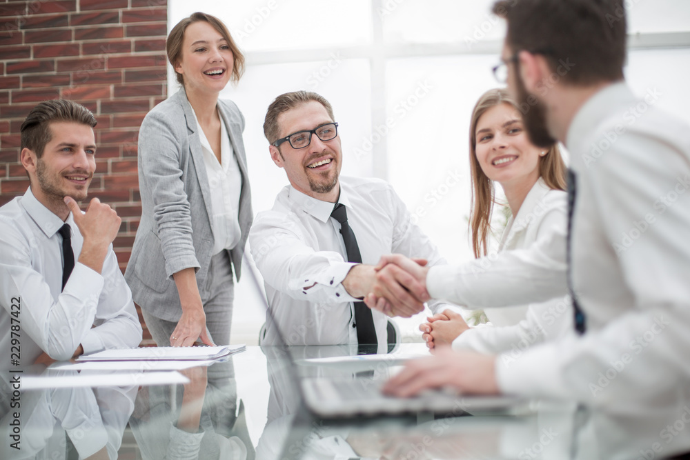handshake financial partners at the Desk handshake financial partners at the Desk